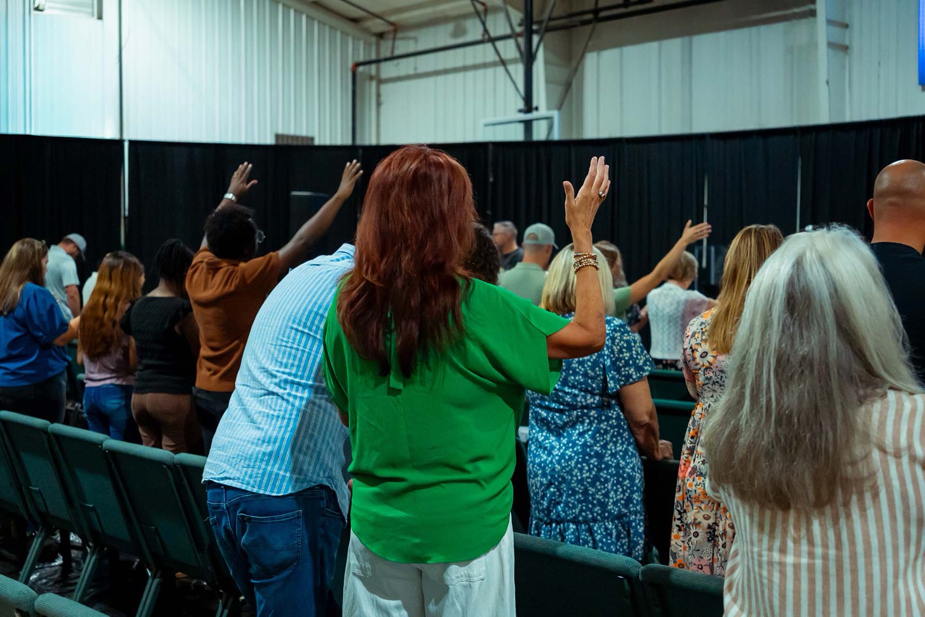 People standing together at a River City Church gathering